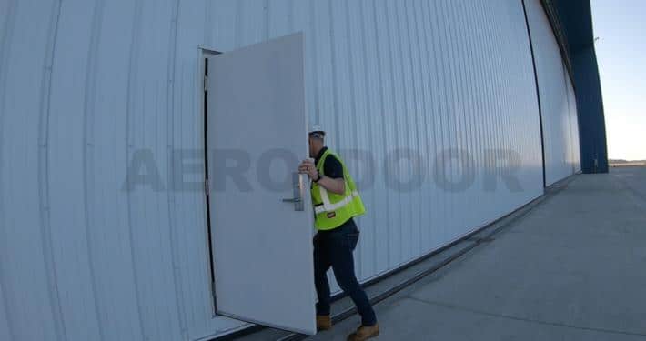 hangar door with personnel door opening