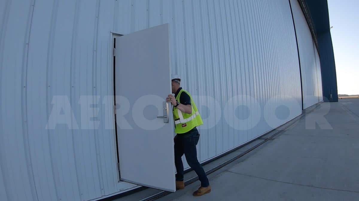 hangar door with personnel door opening